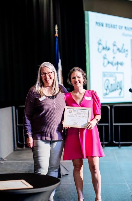 Picture of Boho Bailey Boutique (Leslie Bailey) receiving The Heart of Main Street Business Award.